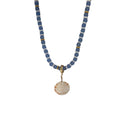Faceted beaded necklace with shell pendant