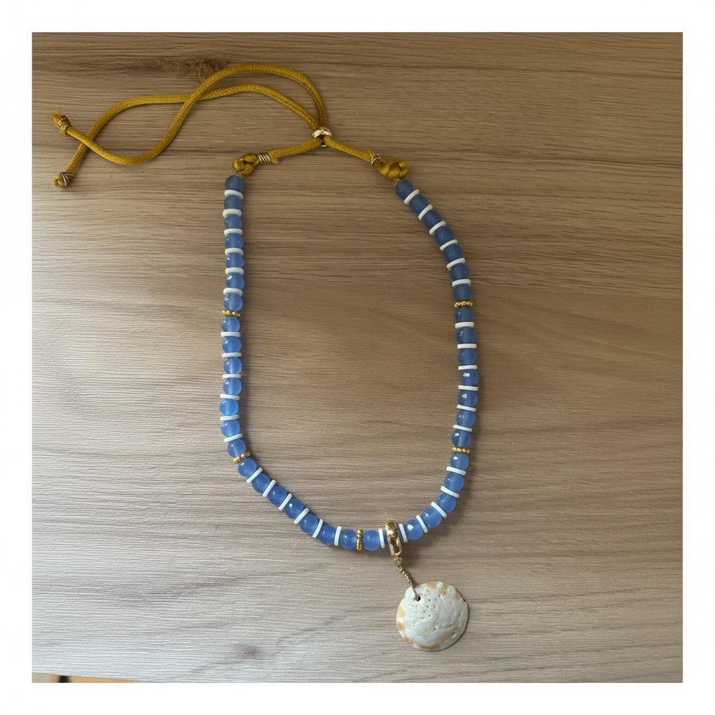 Faceted beaded necklace with shell pendant